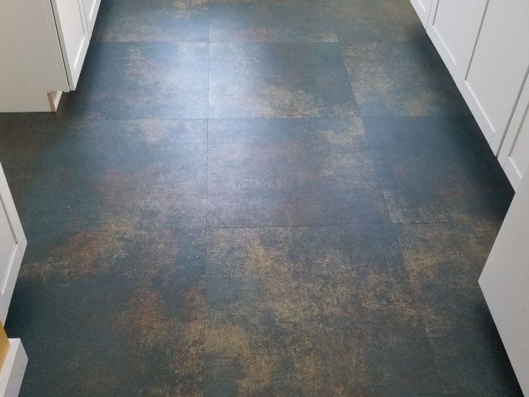 Special-order LVT with a thick wear layer, sealed for durability in a high-traffic area