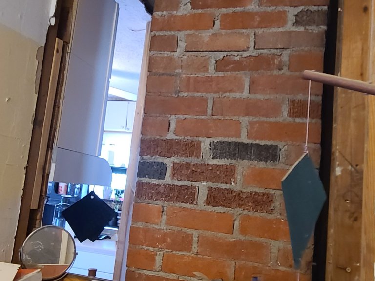 View from the bedroom hallway into the kitchen