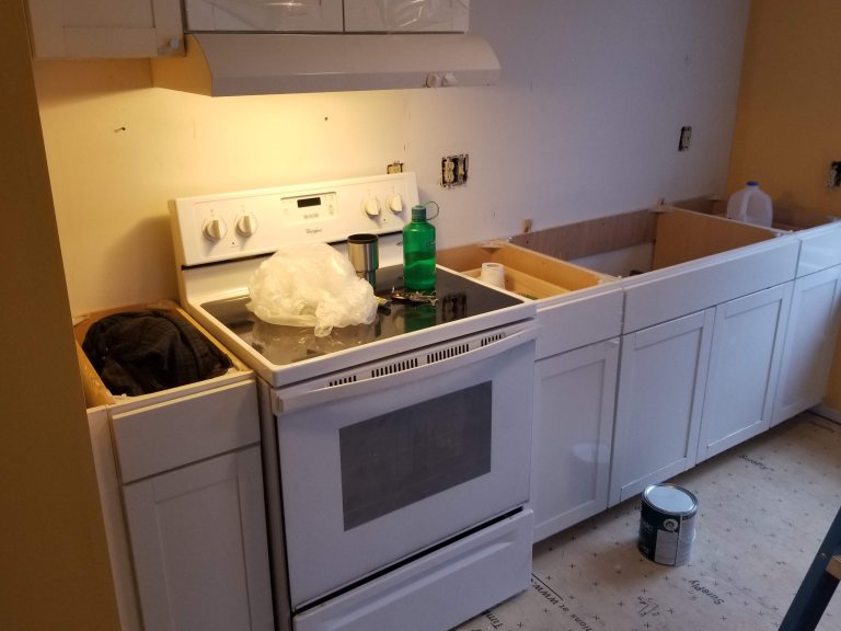 White shaker cabinets going in after primer and paint