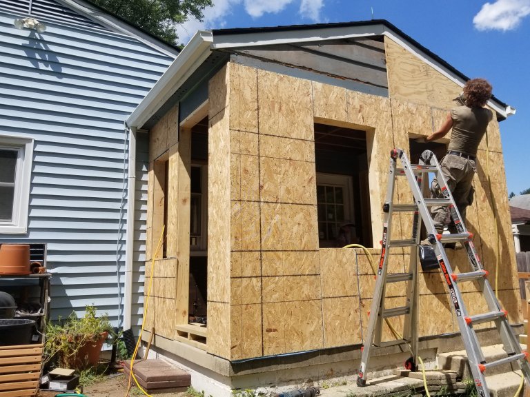 Sheathing the new addition — tying the porch structure into conditioned space