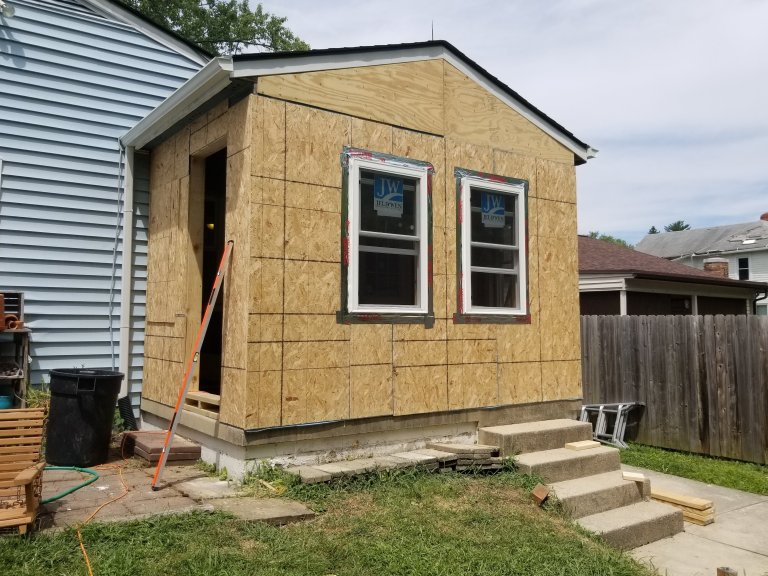 Addition sheathed with new windows installed — ready for exterior finish