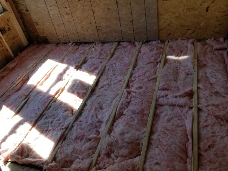 Insulation between vapor barrier and subfloor