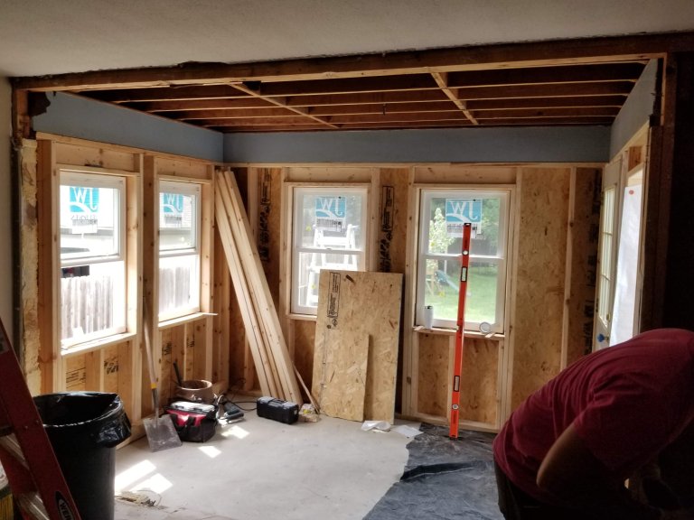 New framing tying the porch structure into the house