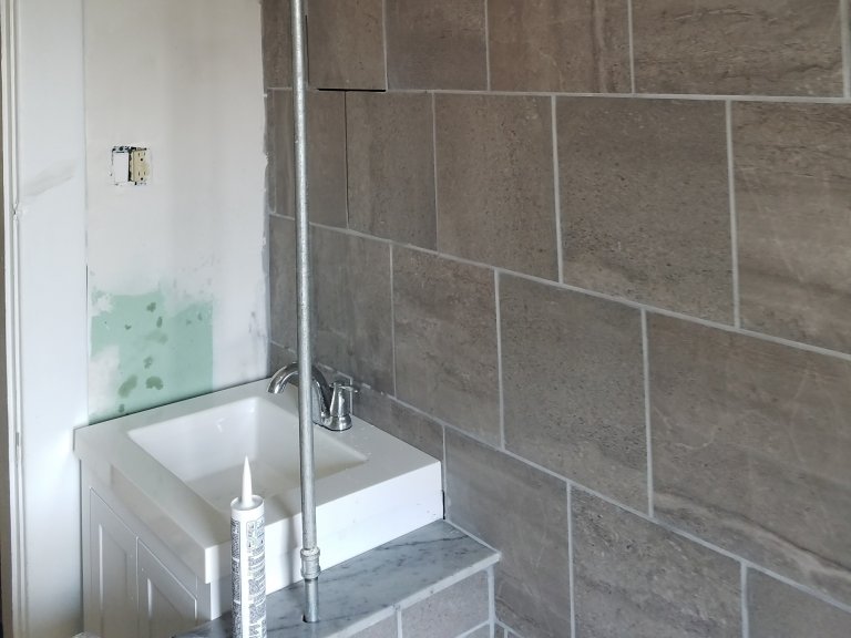 Bath wall grouted