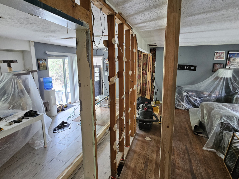 E.B. — Bearing Wall & I-Beam Installation — During