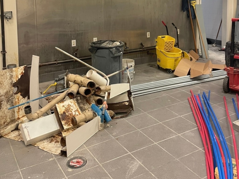 Corroded old drain lines on the left. New PEX supply lines on the right ready for install